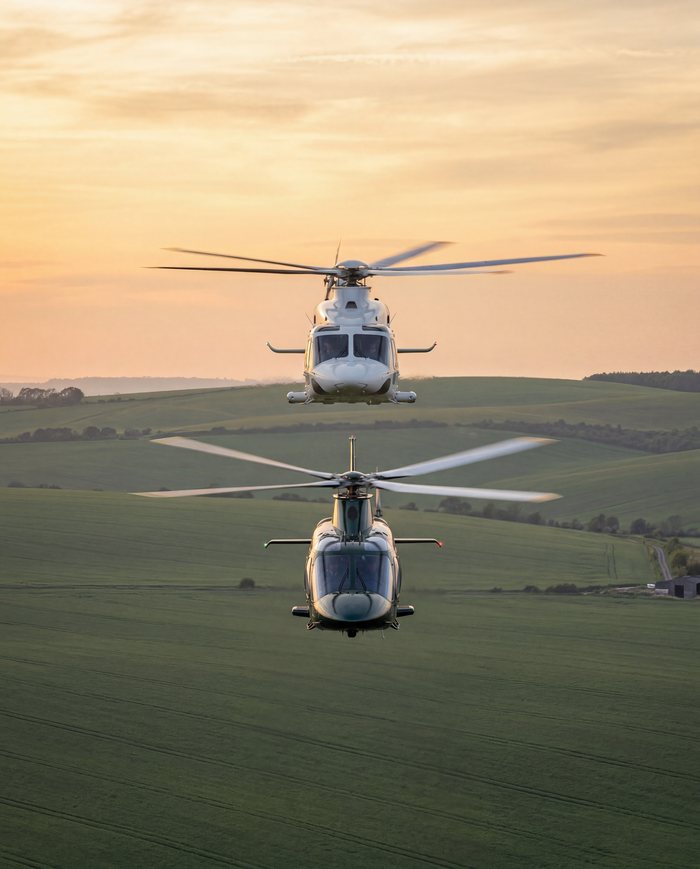 Two helicopters parked on grass