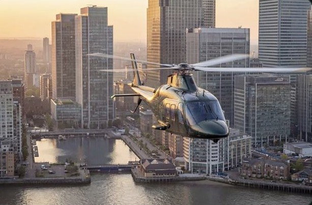 Helicopter flying past high rise towers